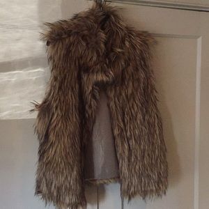 Faux fur vest. Fully lined.
